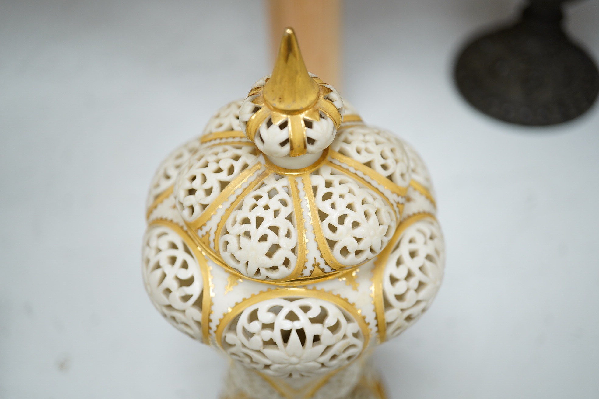 A Grainger's reticulated vase and cover, with gilded decoration, 24cm high. Condition - cover broken and repaired